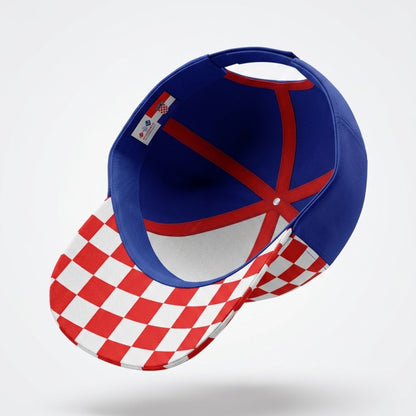 Blue and red cap with checkered brim on a white background