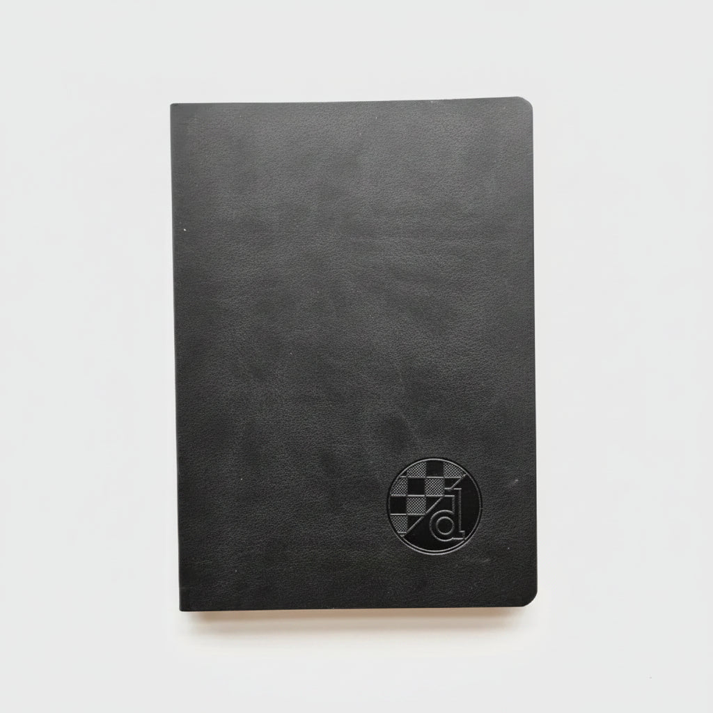 Black notebook with a circular logo on a white background
