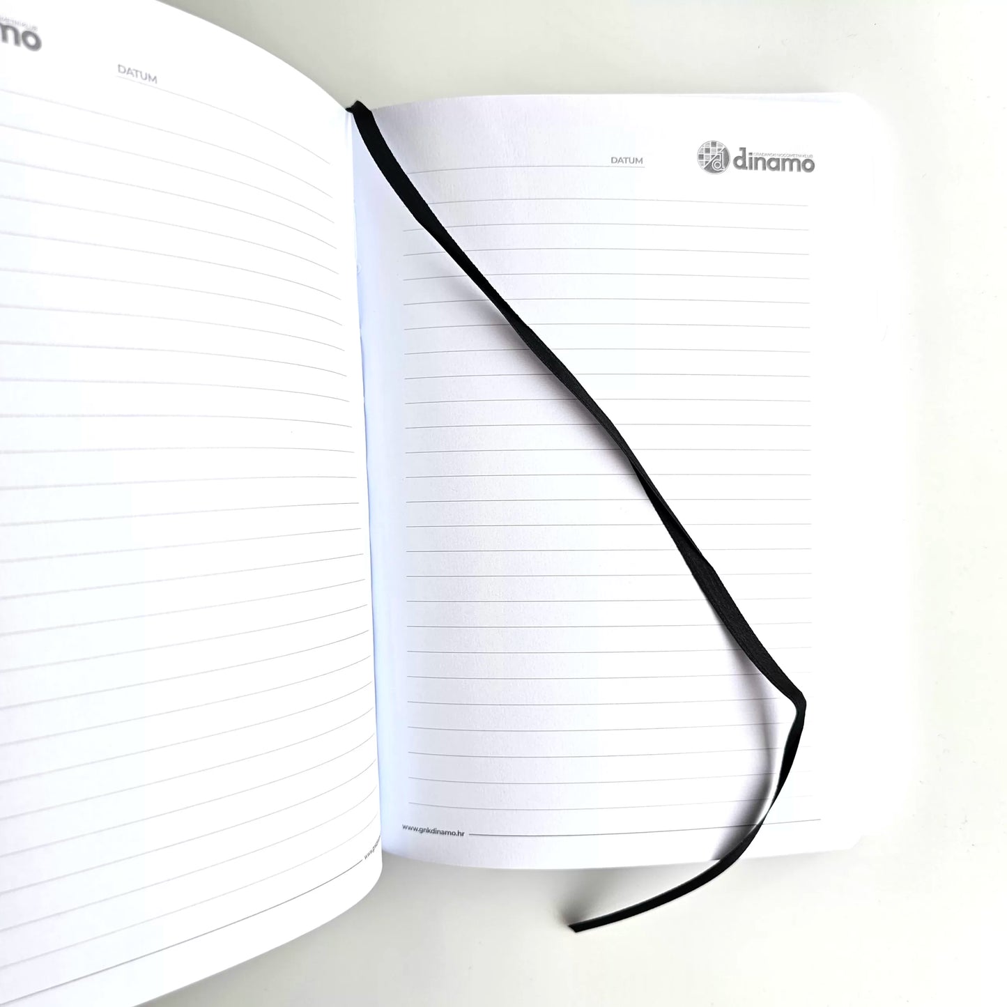 GNK Dinamo B5 Writing Book / Note Pad – Black Marble Edition Notebook with lined pages and a black elastic band closure on a white background, featuring the 'Dinamo' brand.